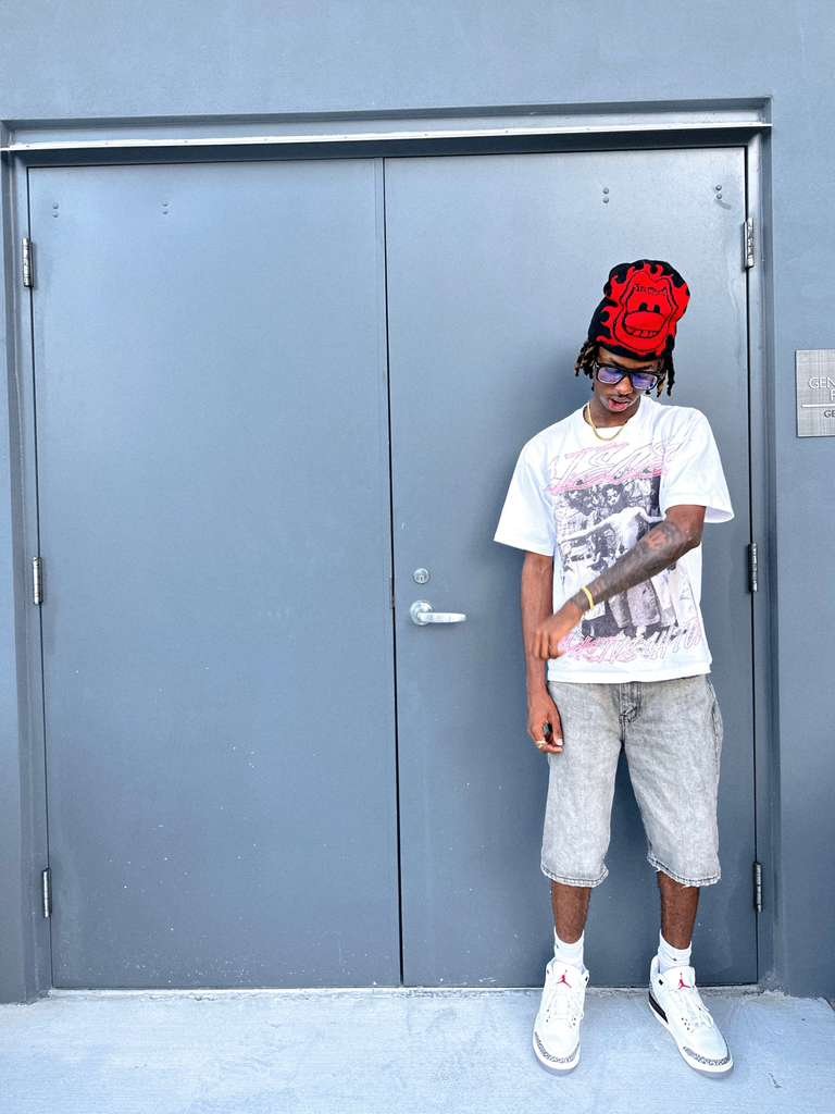 Red devil beanie, graphic tee and Air Jordans
