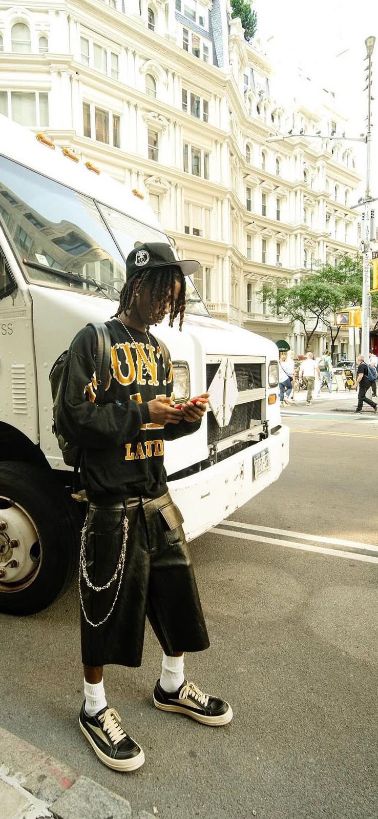 Leather shorts and varsity knit on a New York street